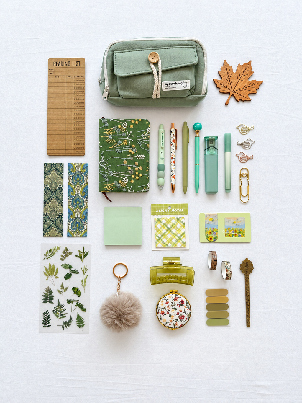 Meadow Glow green fall stationery collection with a journal, writing tools, bookmarks, sticky notes, and seasonal desk accessories. Product photo 1 of 4.