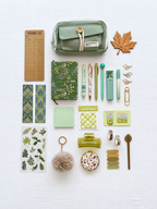 Meadow Glow green fall stationery collection with a journal, writing tools, bookmarks, sticky notes, and seasonal desk accessories. Product photo 1 of 4.