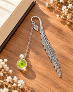 Silver-tone metal feather bookmark with a colorful floral charm for books and journals. Product photo 5 of 6.