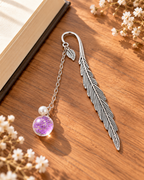 Silver-tone metal feather bookmark with a colorful floral charm for books and journals. Product photo 6 of 6.