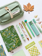 Meadow Glow green fall stationery collection with a journal, writing tools, bookmarks, sticky notes, and seasonal desk accessories. Product photo 2 of 4.