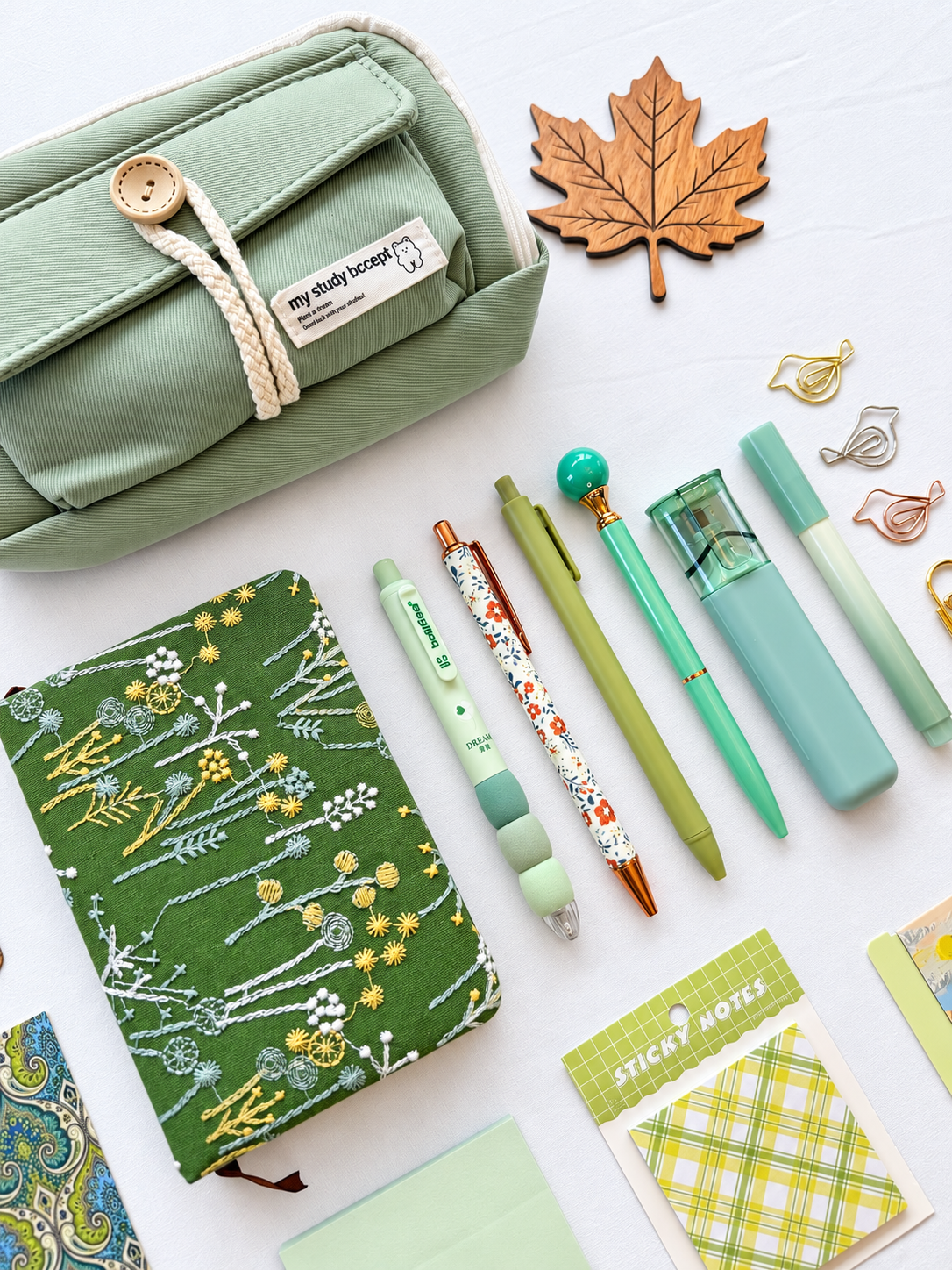 Meadow Glow green fall stationery collection with a journal, writing tools, bookmarks, sticky notes, and seasonal desk accessories. Product photo 2 of 4.