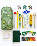 Into the Wild Premier Kids Collection flat lay with green panda pencil case, A7 pocket journal, novelty writing tools, decorative notepad, bookmark, stickers, page holder, and green keychain.