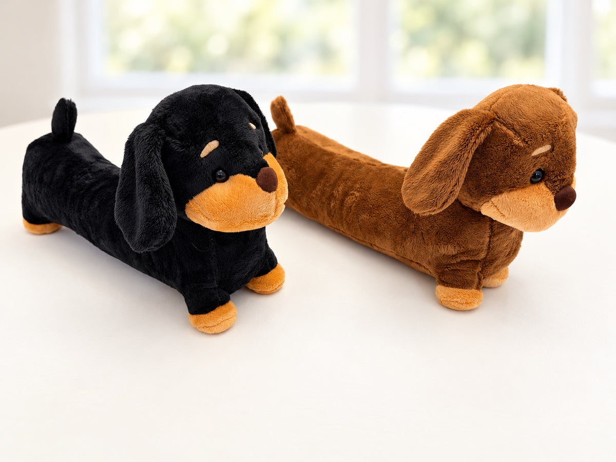 Black and brown plush dachshund stuffed animals side by side