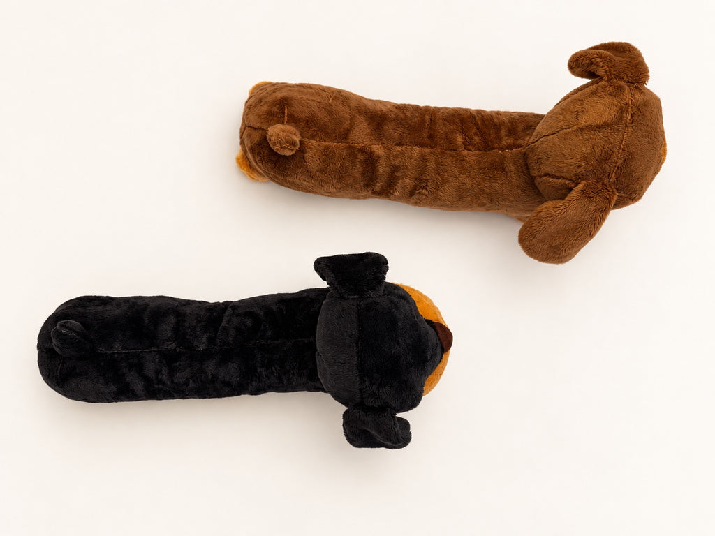 Overhead view of two plush dachshunds