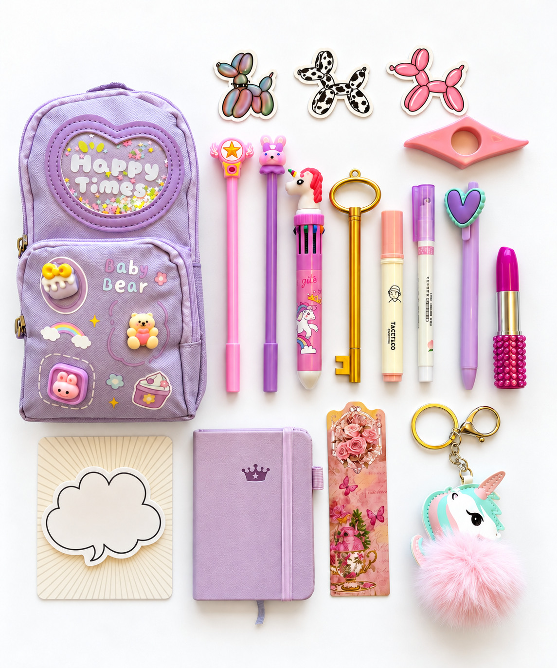 Once Upon a Time Premier Kids Collection flat lay with lavender specialty pencil case, A7 pocket journal, novelty writing tools, notepad, bookmark, stickers, page holder, and fluffy unicorn keychain.